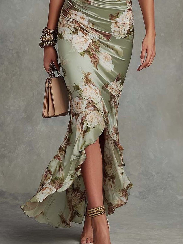 Women's elegant green asymmetrical flowing maxi dress, a perfect occasion or celebration dress with a unique silhouette.