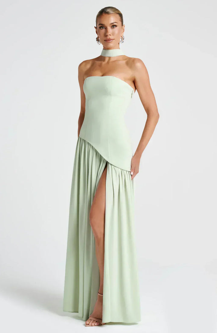 Detailed back shot of women's asymmetric maxi dress, showcasing the flowing fabric and design.