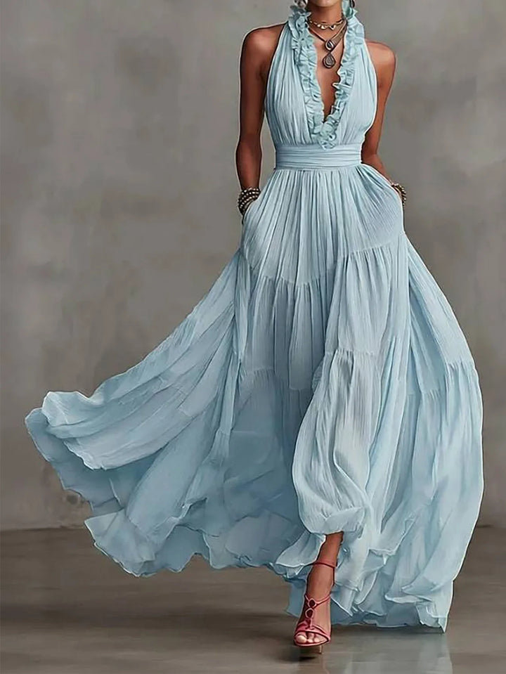 Beautiful backless women's maxi dress with sophisticated ruffle trim and pleated skirt, ideal for evening events.