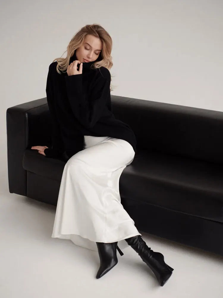 Formal full-length high-waist fishtail maxi skirt for elegant evening ensembles.