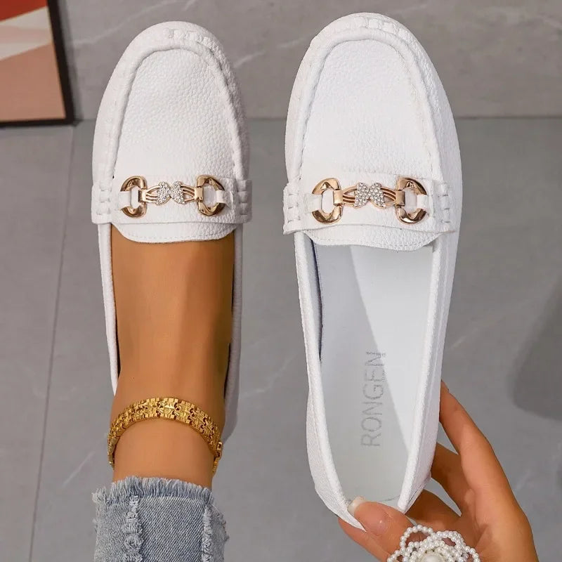 Elegant women's black loafers with sparkling crystal chain, ideal for casual and dress wear.