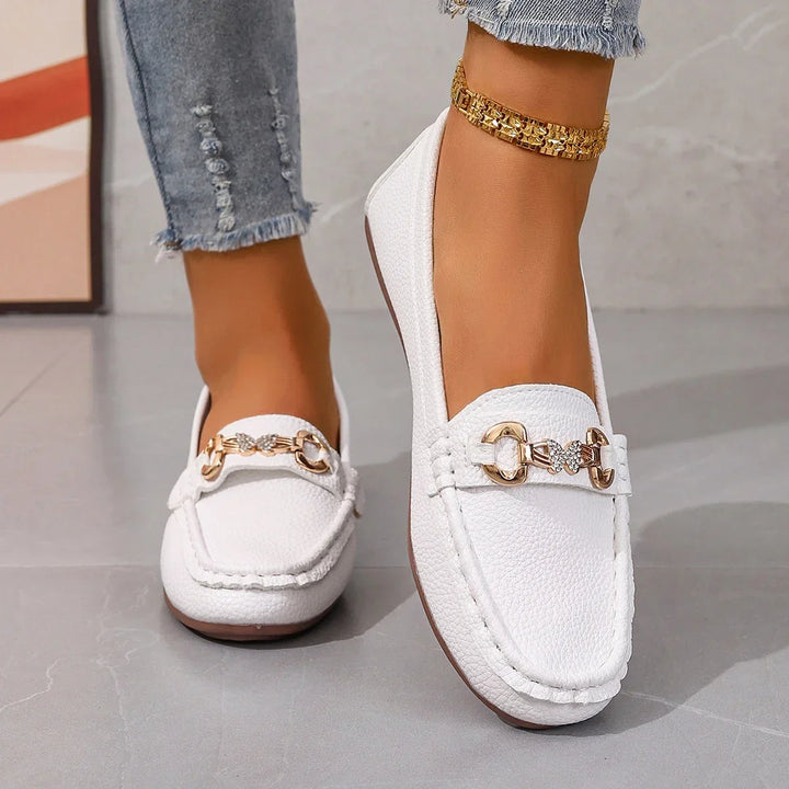 Comfortable women's loafers with cushioned insole and crystal chain detail, perfect for all-day wear.
