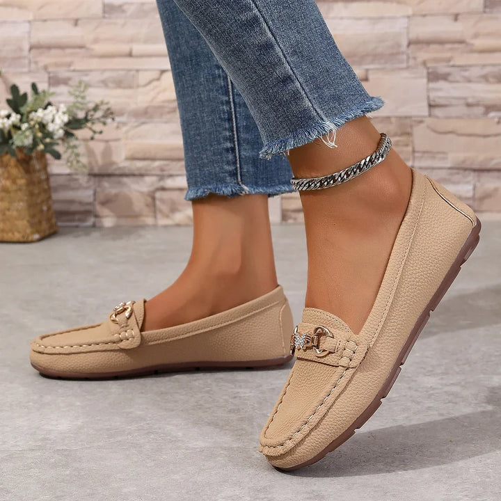 Women's fashion loafers with a prominent crystal chain, crafted from high-quality faux leather.