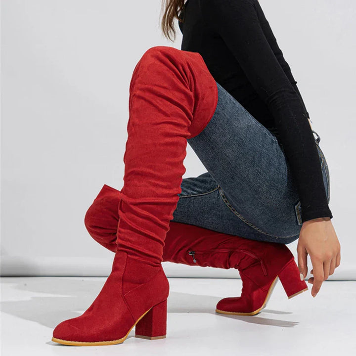 Close-up of the heel and sole of women's over-the-knee fashion boots, highlighting quality