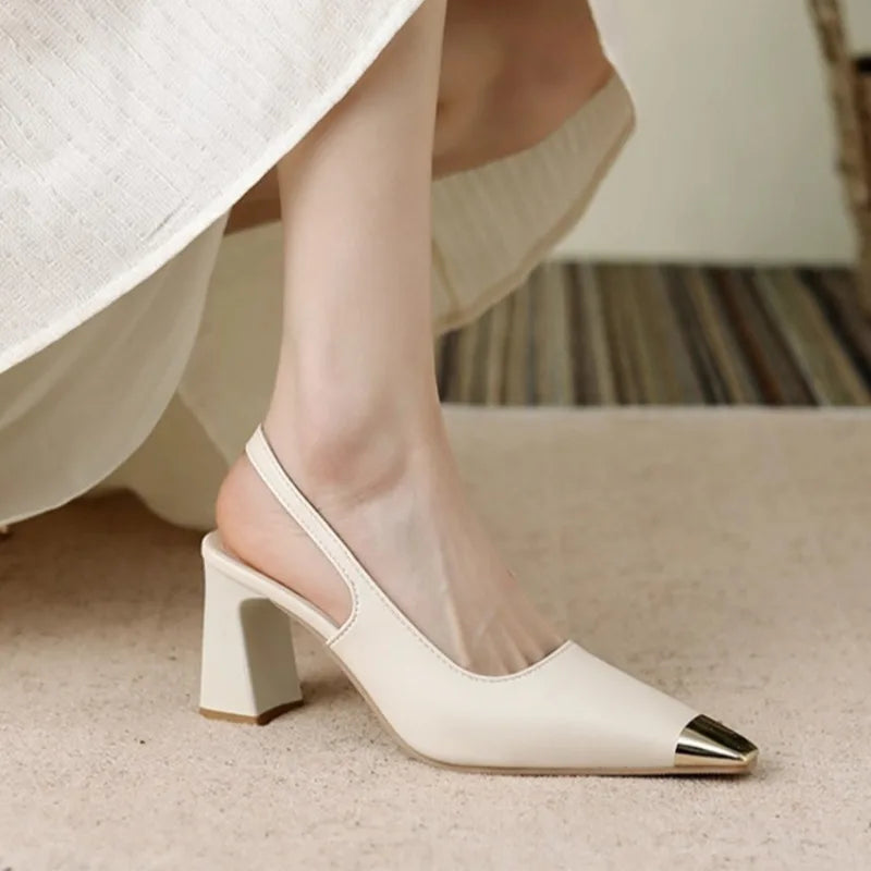 Stylish women's black slingback heels with metallic trim, suitable for work or elegant events