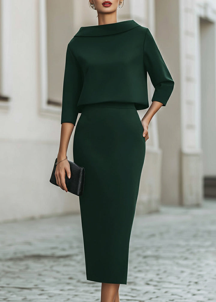 Professional women's matching boat neck top and midi skirt with 3/4 length sleeves.