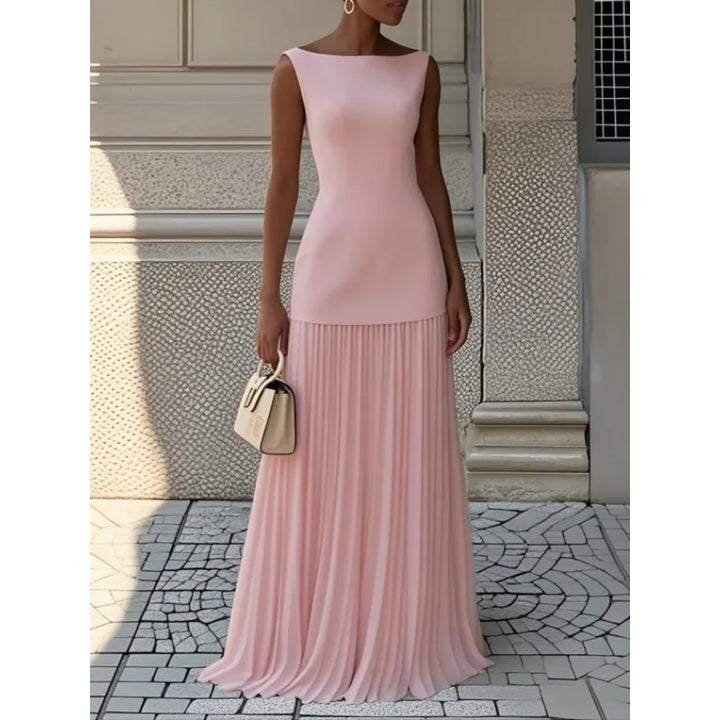 Sophisticated women's boat neck maxi dress. Elegant pleated skirt creates a flowing, flattering silhouette.
