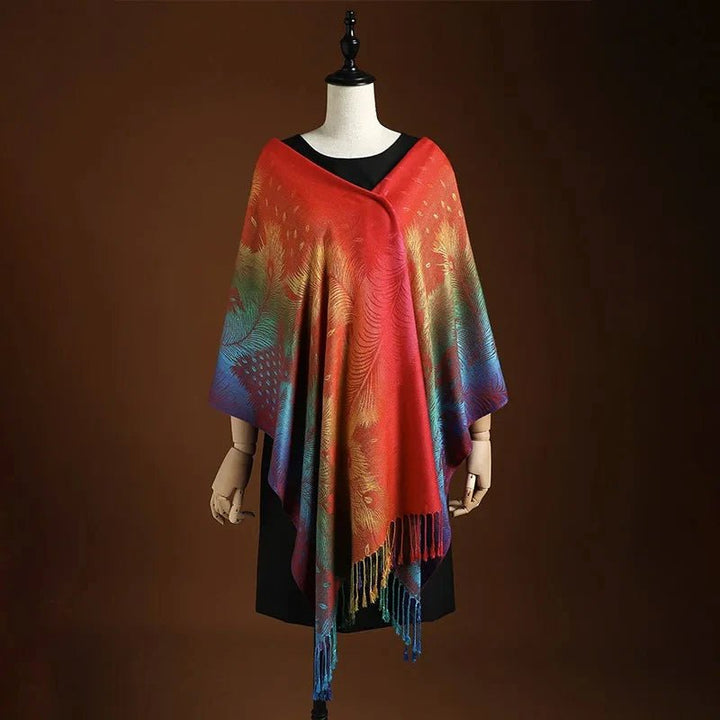 Vibrant peacock patterned wrap for women, featuring a bohemian design and chic fringe. A versatile fashion accessory.