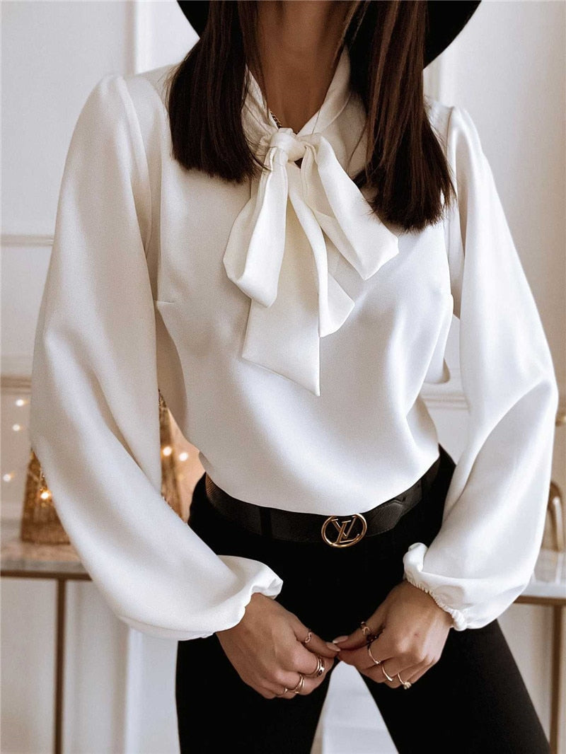 Stylish women's bow neck blouse with long sleeves, offering a versatile and elegant look for any occasion