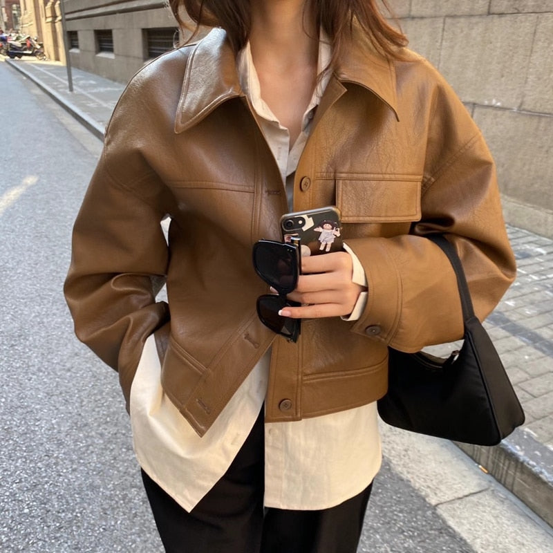 Elegant women's brown zip-up jacket, tailored for casual and versatile outerwear fashion.