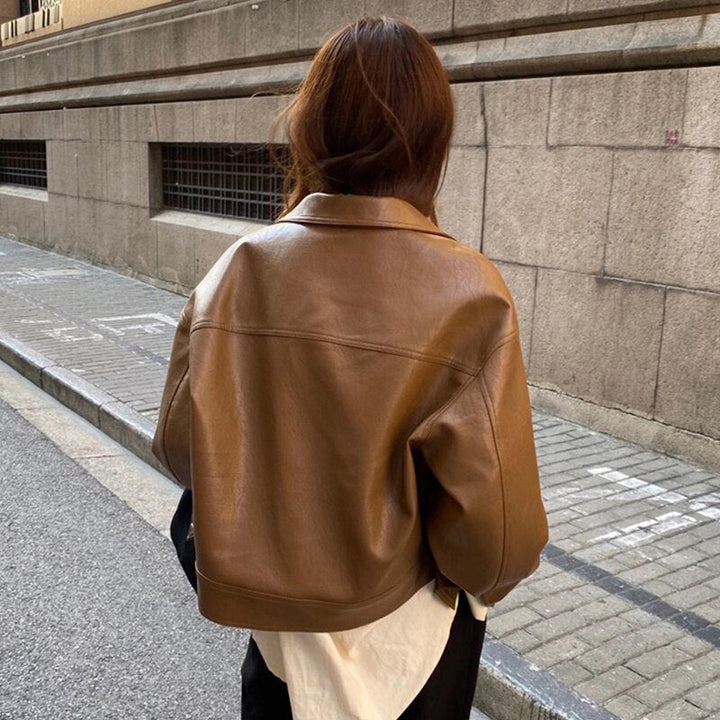 Lightweight brown zip-up jacket for women, a stylish and elegant casual outerwear piece.