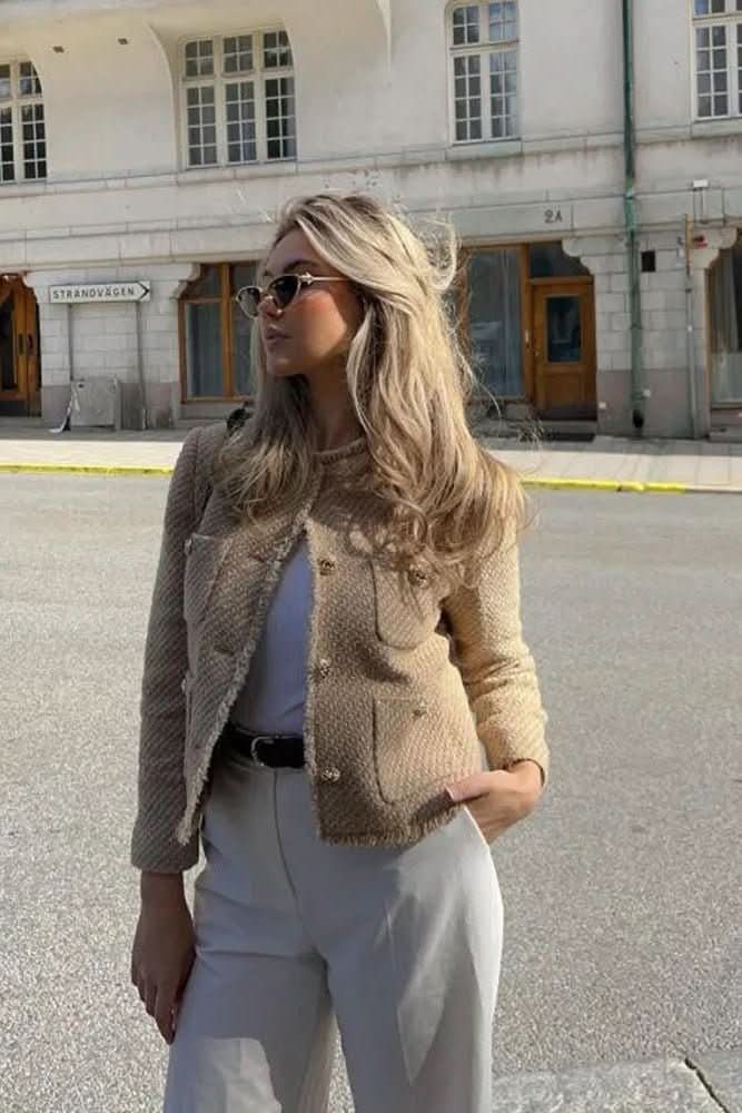 Stylish women's cropped blazer with button front. A versatile fashion top for elegant, professional, and chic looks.