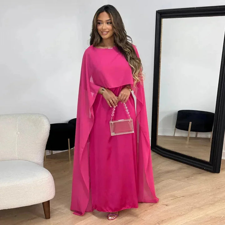 Women's evening gown with a graceful flowing cape, ideal for special occasions and sophisticated events.