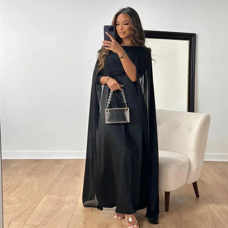 Formal women's maxi dress featuring an integrated cape, designed for weddings and elegant evening wear.