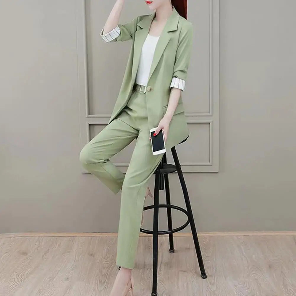 Fashionable women's blazer, tailored pants, and matching top, a perfect coordinated suit for workwear.
