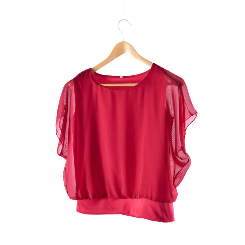Feminine women's blouse featuring delicate ruffled sleeves and a classic round neck.