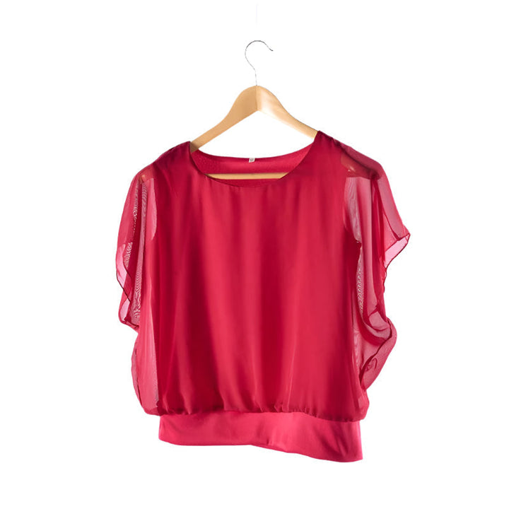 Feminine women's blouse featuring delicate ruffled sleeves and a classic round neck.