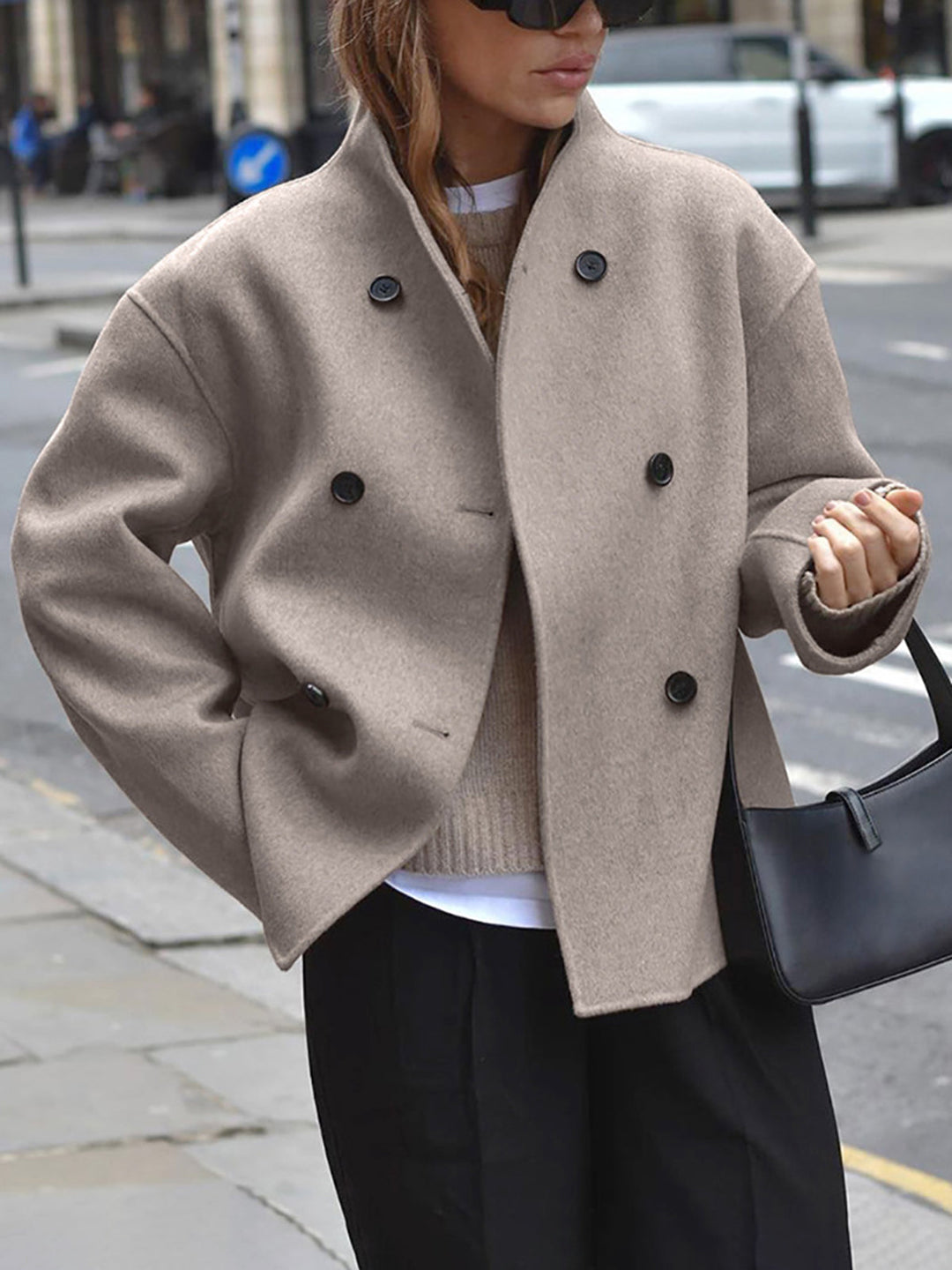Chic women's double-breasted khaki coat with classic tailoring, ideal for elegant winter fashion.