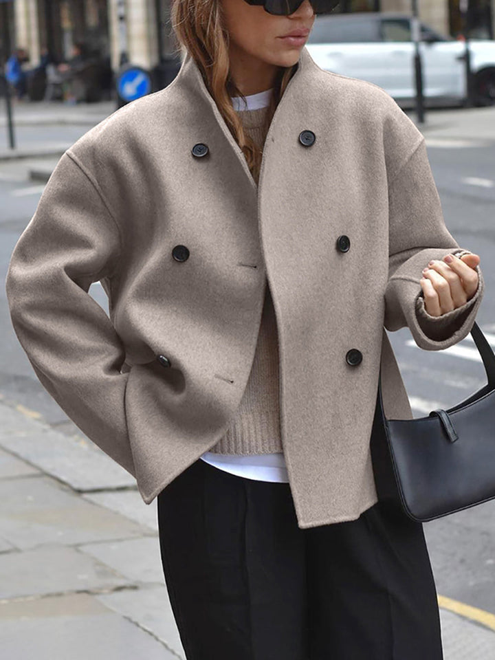 Chic women's double-breasted khaki coat with classic tailoring, ideal for elegant winter fashion.