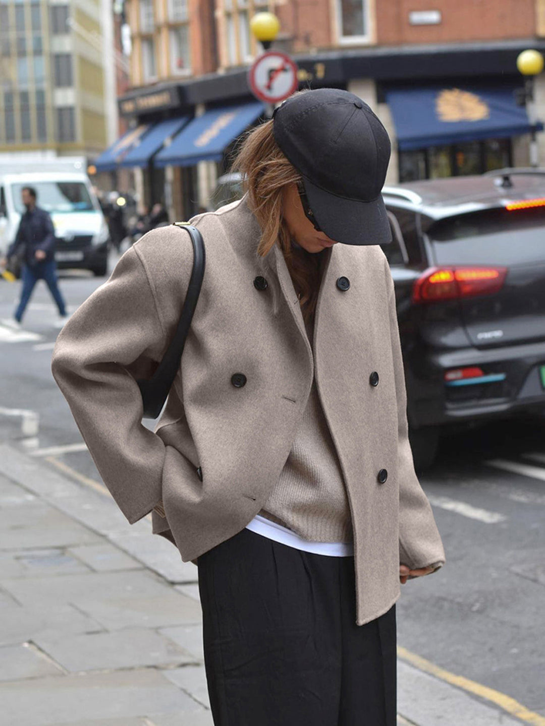 Classic gray double-breasted coat for women, showcasing sophisticated and tailored outerwear style.