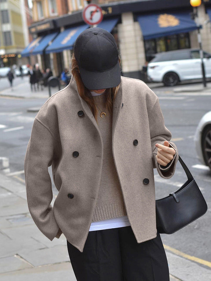 Stylish women's khaki double-breasted coat, a chic and elegant piece of winter outerwear.
