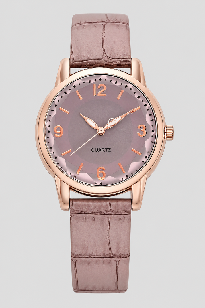Elegant women's classic watch with a minimalist face and a stylish embossed strap, perfect for everyday wear.