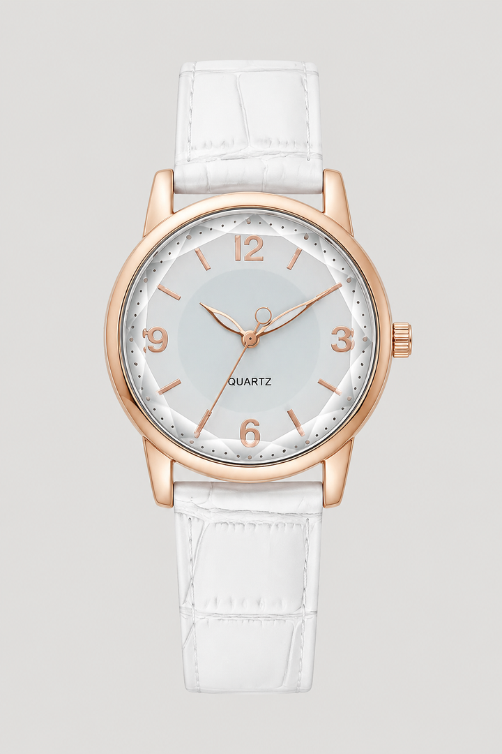 Fashionable women's classic watch, showcasing a clean minimalist dial and an exquisitely embossed strap. Elegant timepiece.