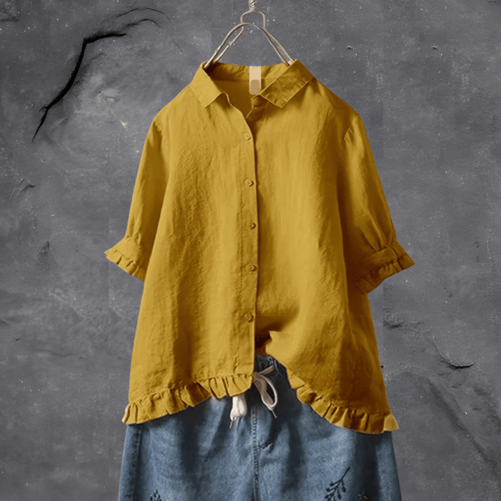 Elegant women's collared blouse with ruffled hem, short sleeves & button front, perfect for work or casual chic.