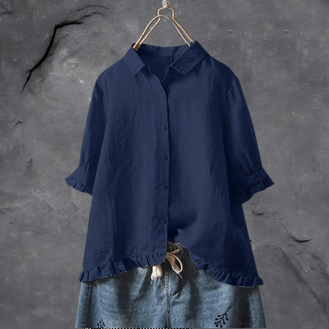 Versatile women's short sleeve blouse with ruffled hem; elegant for spring/summer workwear or casual outfits.