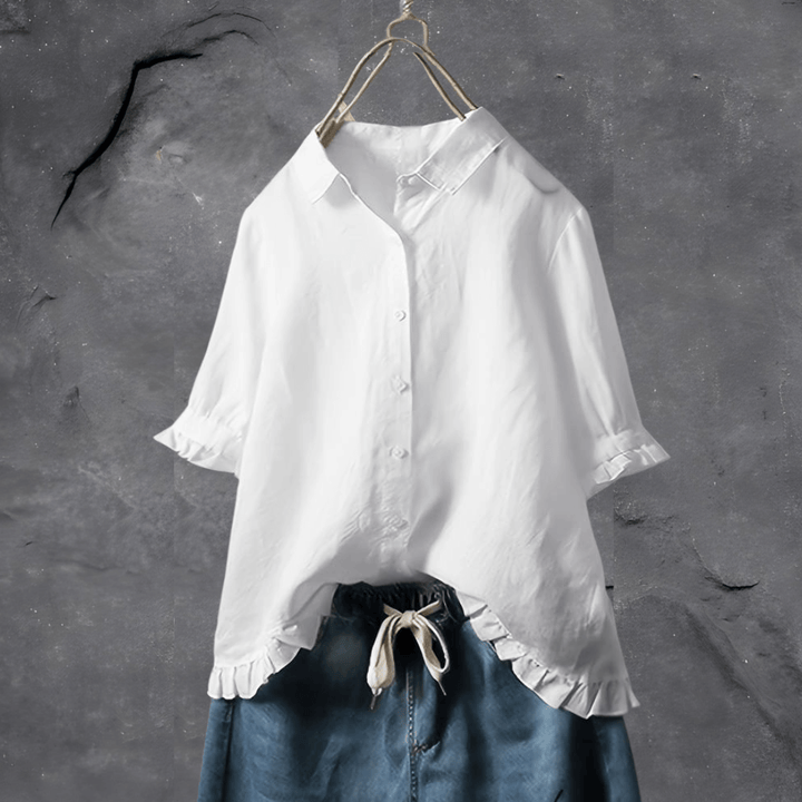 Feminine collared blouse for women, featuring a stylish ruffled hem & button front, ideal for elegant spring fashion.