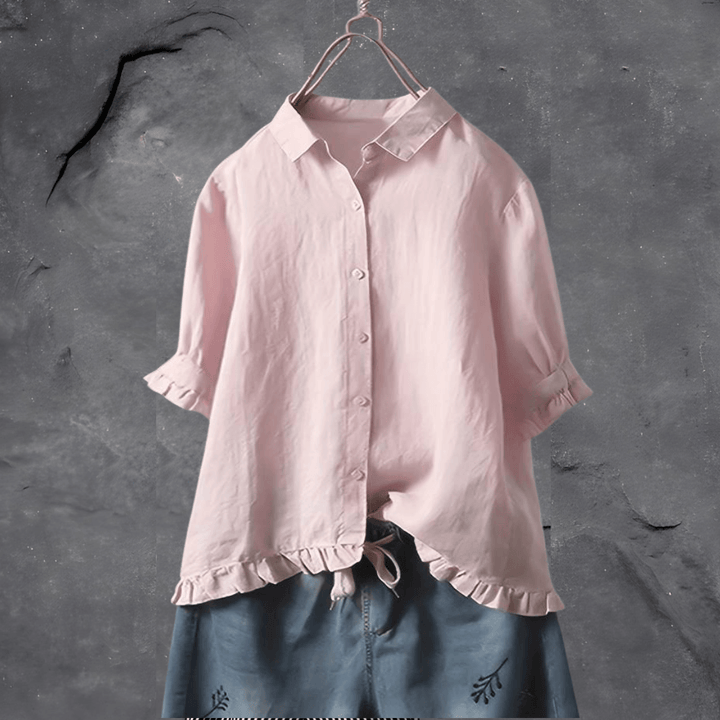 Chic women's short sleeve collared top with elegant ruffled hem. A versatile button-front blouse for any stylish occasion.