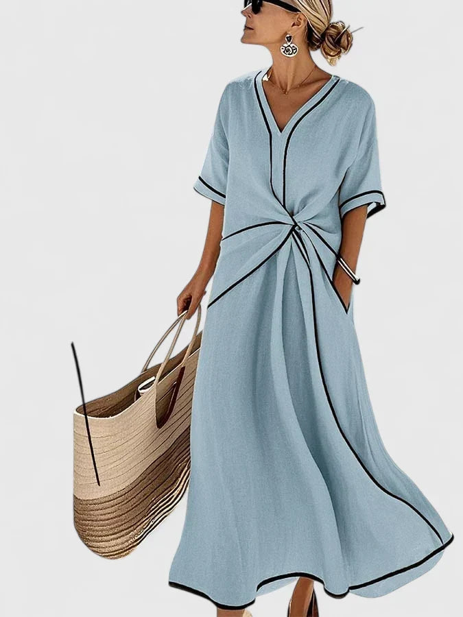Flattering women's maxi dress with twist front & contrast trim, great for beach, resort, or day wear.