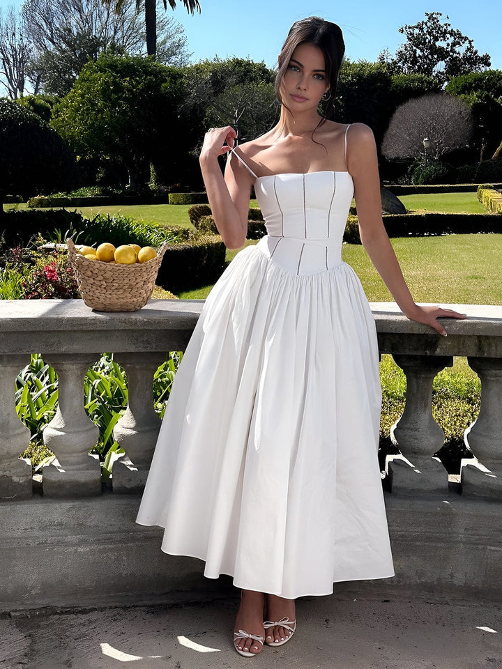 Formal women's wedding guest midi dress with corset detailing, suitable for elegant events.