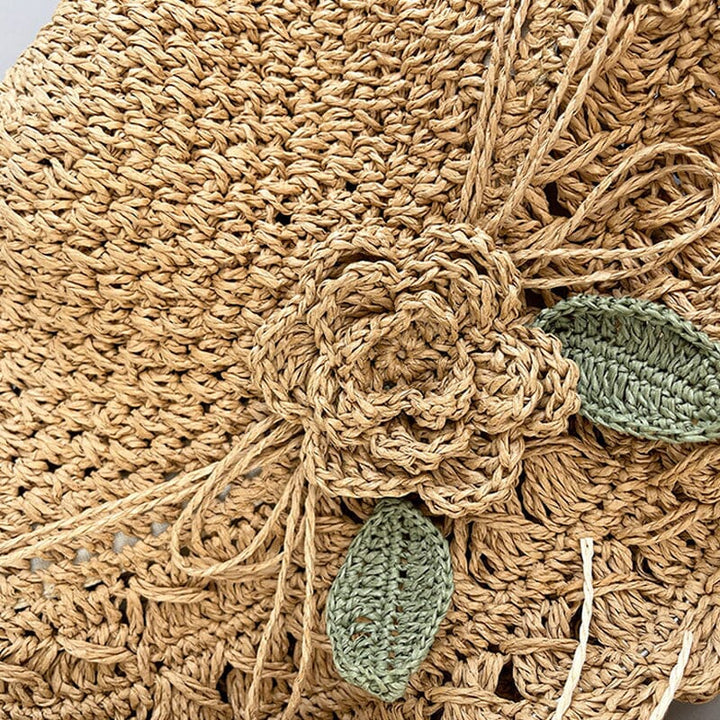 Beach-ready women's crochet straw sun hat, offering chic sun protection with an elegant ruffle.