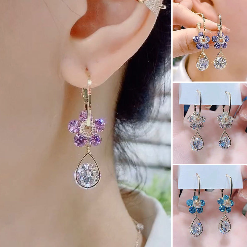 Stylish women's earrings with a prominent crystal flower motif, an eye-catching jewelry piece