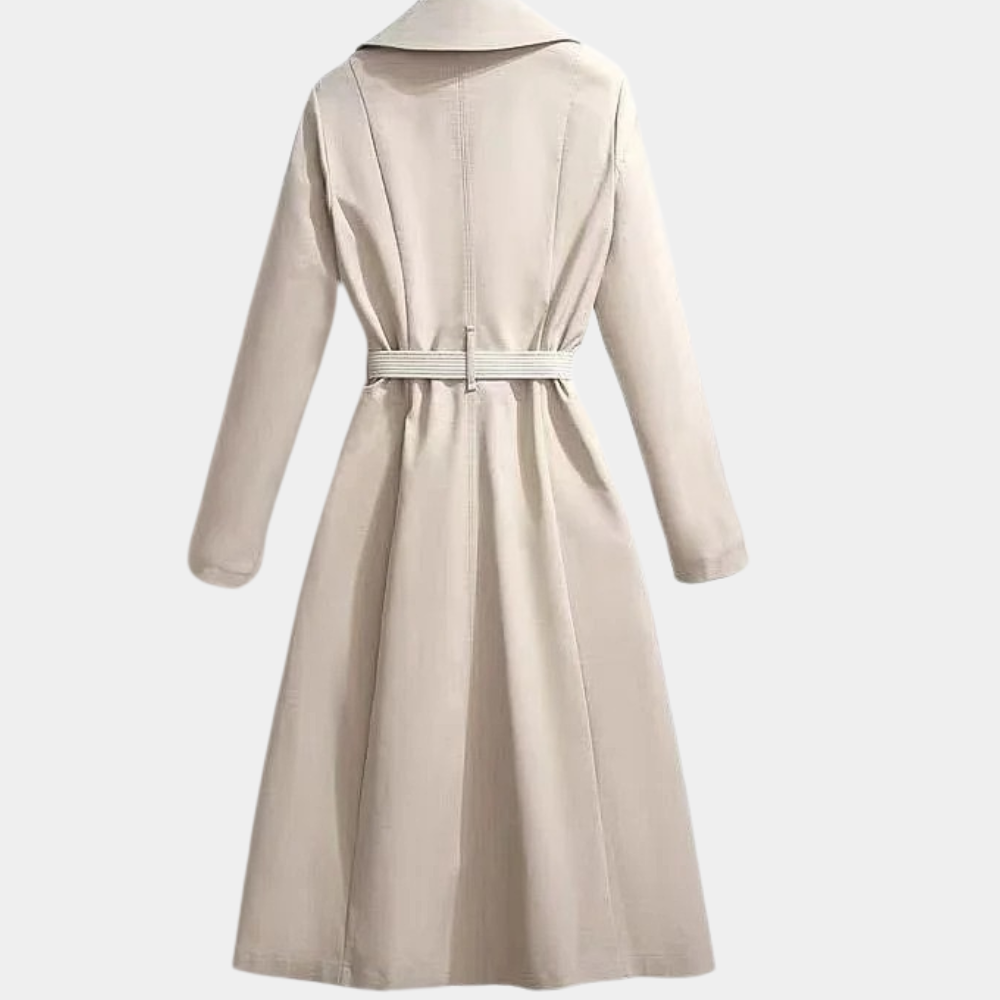 Classic women's trench coat with double-breasted front, belt, and scarf detail, ideal winter outerwear.