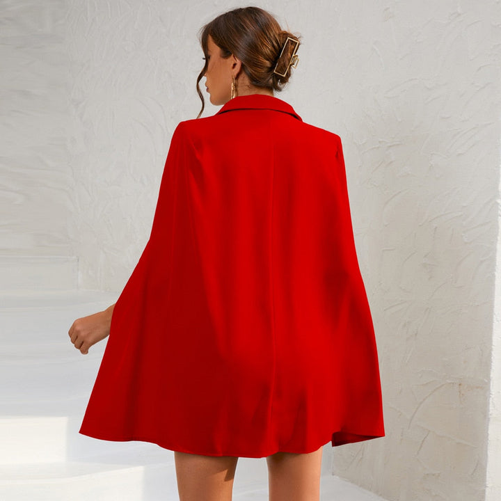 Women's double-breasted cape dress with belt, a versatile piece for elegant gatherings