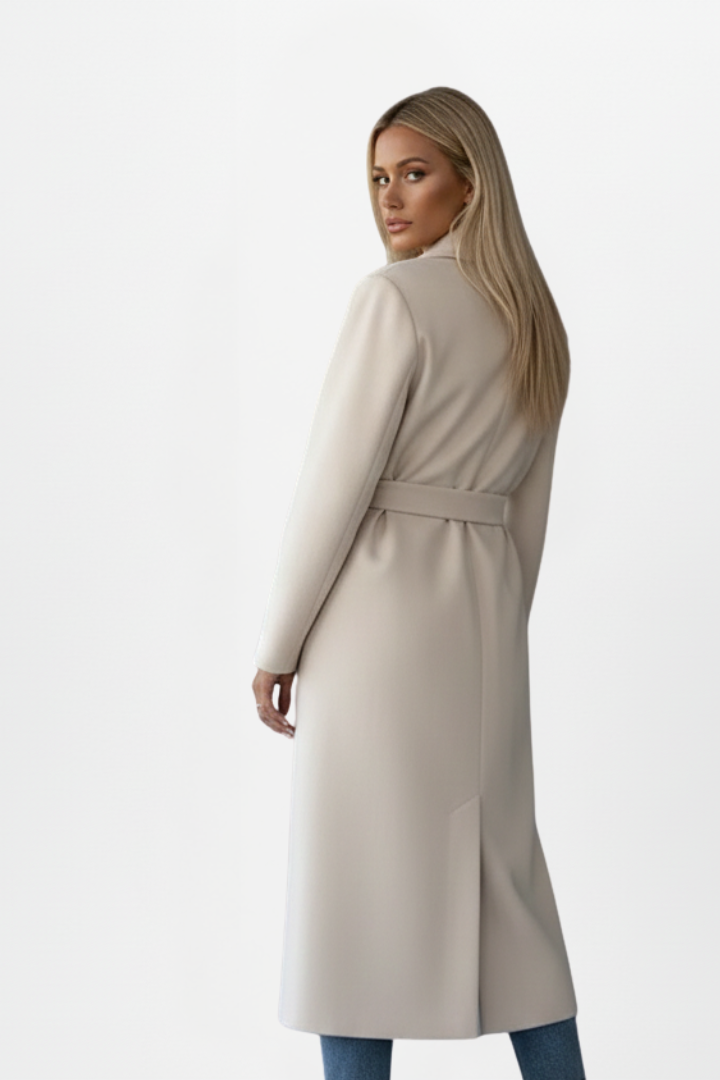 Classic women's elegant long coat with double-breasted front and belted waist. Perfect for formal outerwear.