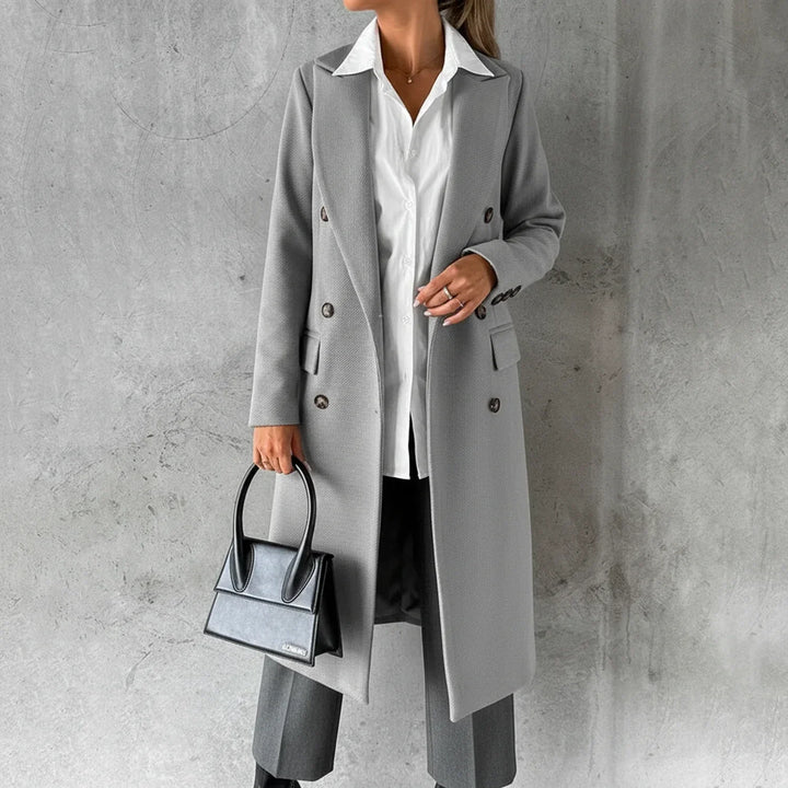 Sophisticated women's long winter coat, double-breasted. Elegant design provides warm, chic fall/winter fashion.