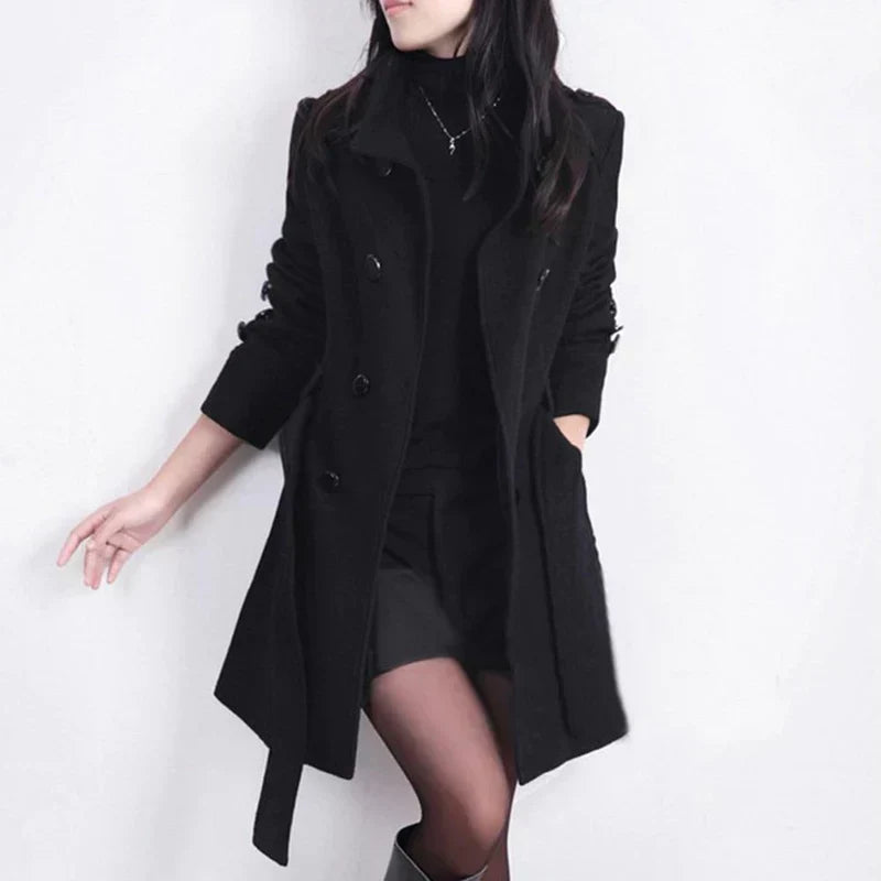 Elegant women's double-breasted trench coat with a belted waist, perfect for business casual fall fashion.