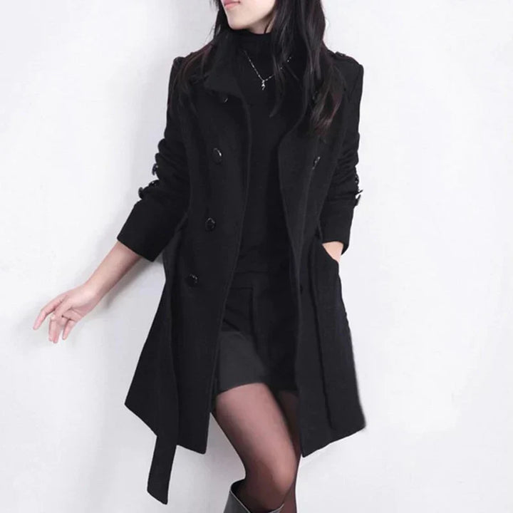Elegant women's double-breasted trench coat with a belted waist, perfect for business casual fall fashion.