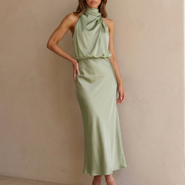 Formal women's elegant midi dress with a flattering draped halter neckline and comfortable blouson waist.