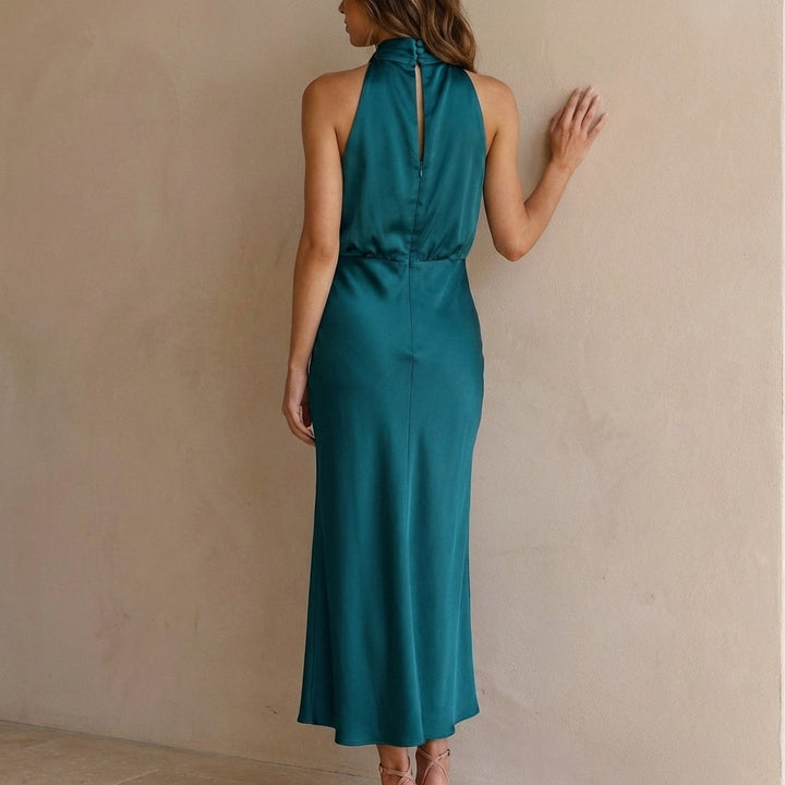 Chic women's draped halter neck midi dress, featuring a blouson waist for an elegant, flowy silhouette.