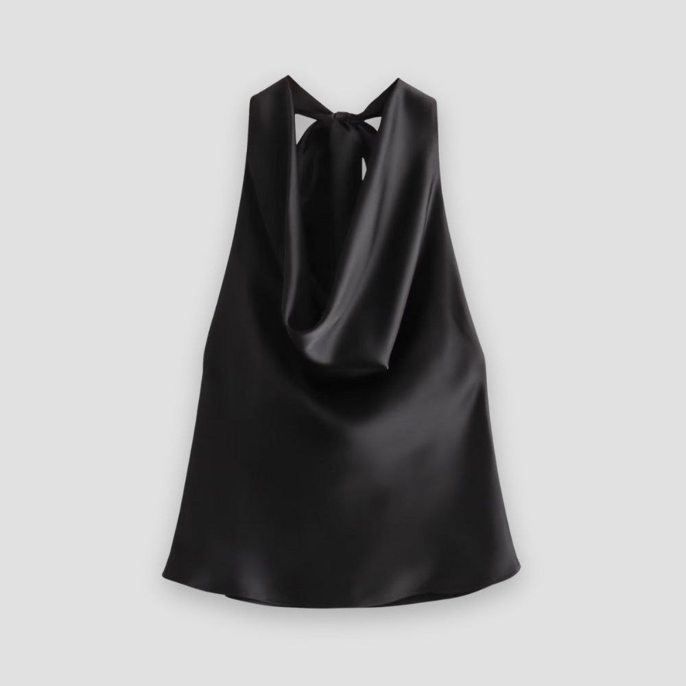 Front detail of a women's satin top with a flattering halter neckline and soft, elegant draping.