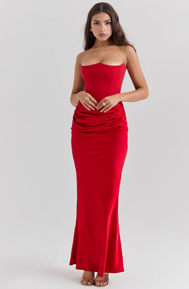 Effortlessly elegant strapless prom dress with a flattering draped column silhouette.