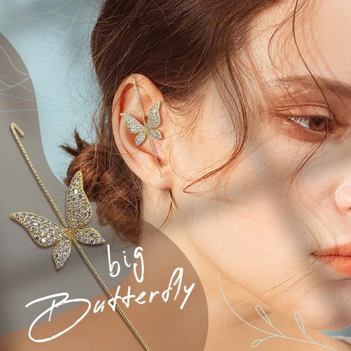 Hypoallergenic women's ear wrap crawler earring, featuring a curved design with embedded rhinestones. Macro detail.