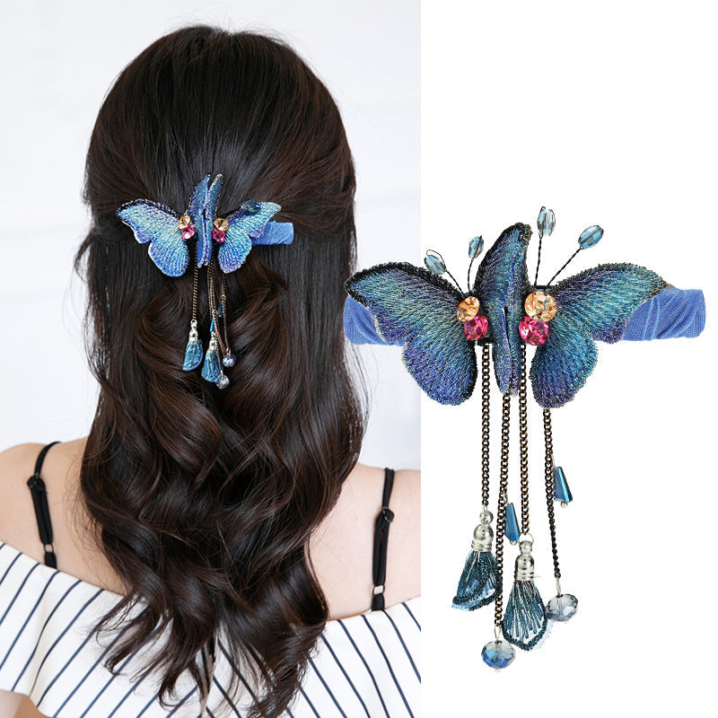 Elegant women's embroidered butterfly hair clip with rhinestones, perfect for party hair.