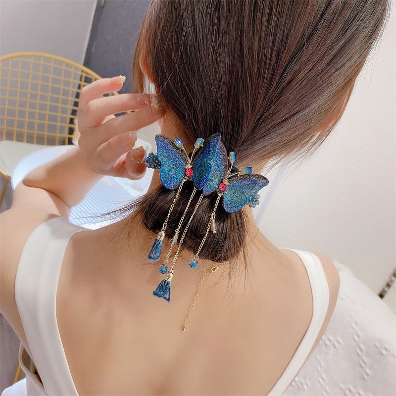 Women's elegant butterfly clip, embroidered detailing and fringe, perfect for adding sparkle to hair.