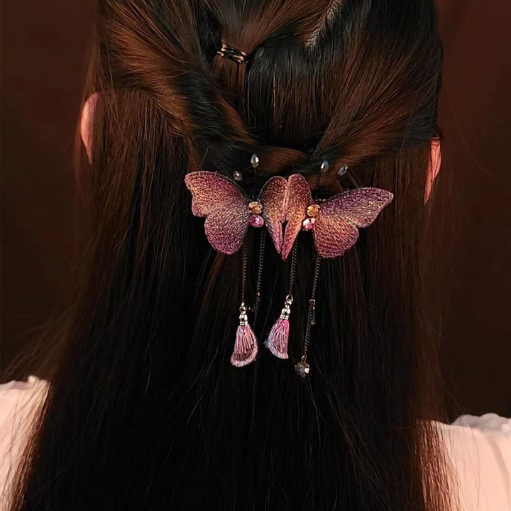Delicate embroidered butterfly hair accessory for women, featuring fringe and glittering rhinestones.