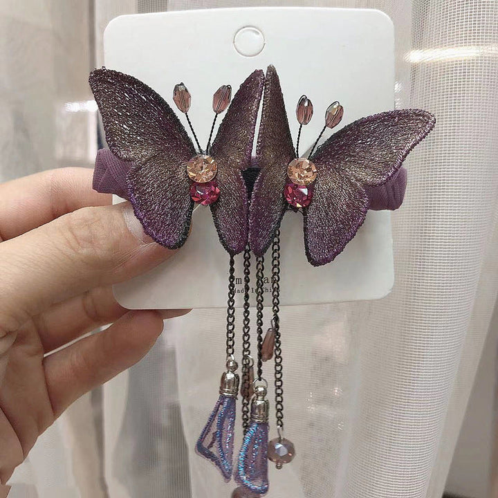 Trendy butterfly fringe hair clip for women, embroidered with rhinestones, great for evening wear.